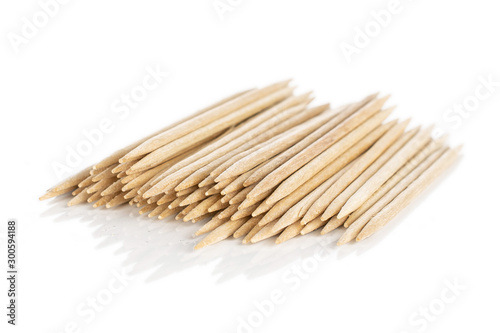 Lot of whole wooden brown toothpick isolated on white background