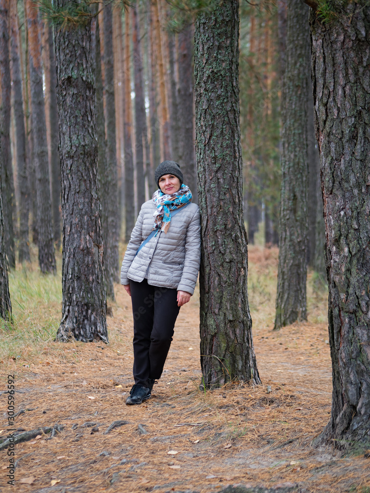 girl in a pine forest in autumn outdoors