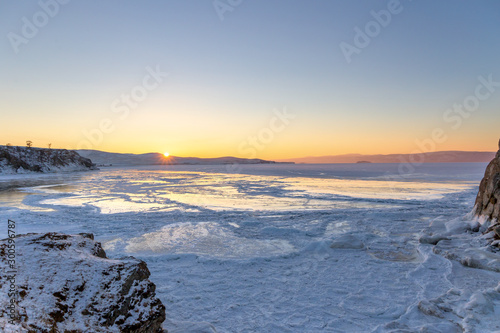 Colorful sunset over the crystal ice of Baikal lake © Elena Sistaliuk