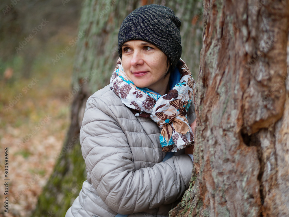 girl in a pine forest in autumn outdoors girl in a pine forest in autumn outdoors