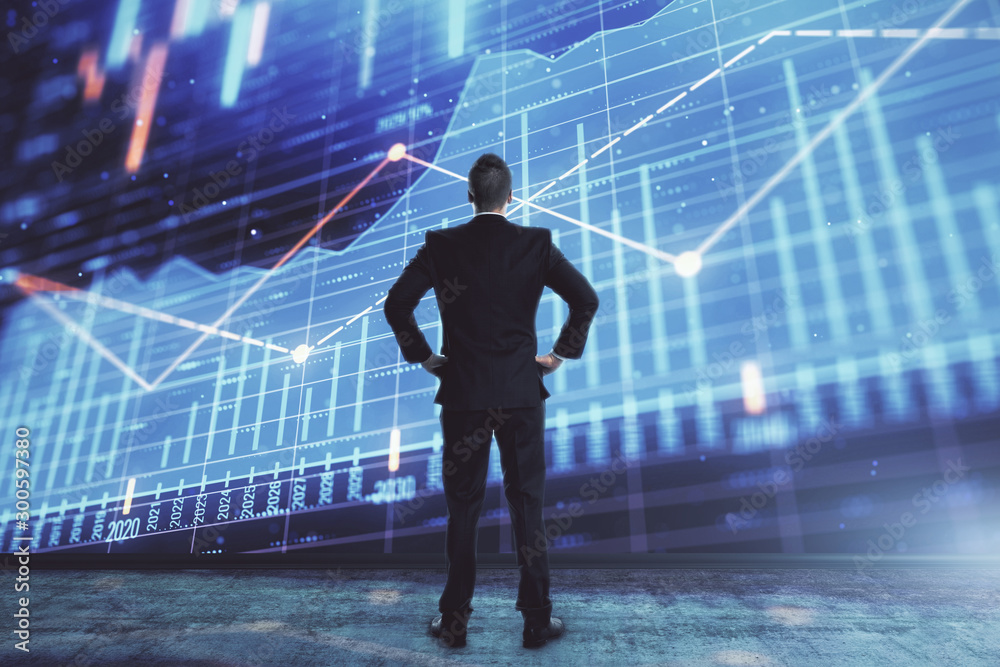 Businessman and forex graph hologram. Double exposure. Concept of financial education and analysis