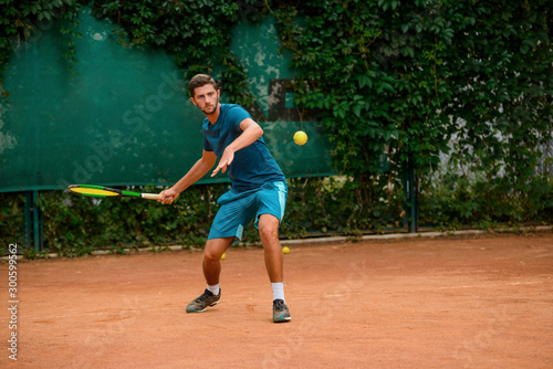 Forehand shot of a skilled tennis player. © yuriygolub
