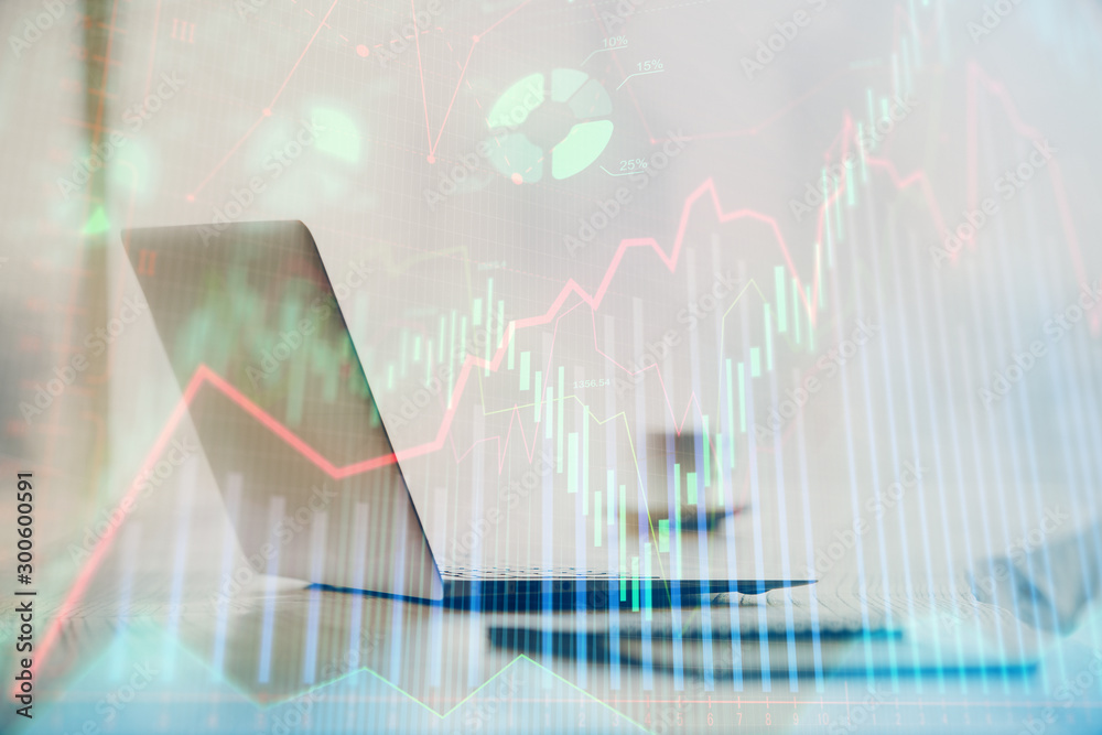 Double exposure of graph and financial info and work space with computer background. Concept of international online trading. Double exposure of graph and financial info and work space with computer background. Concept of international online trading.