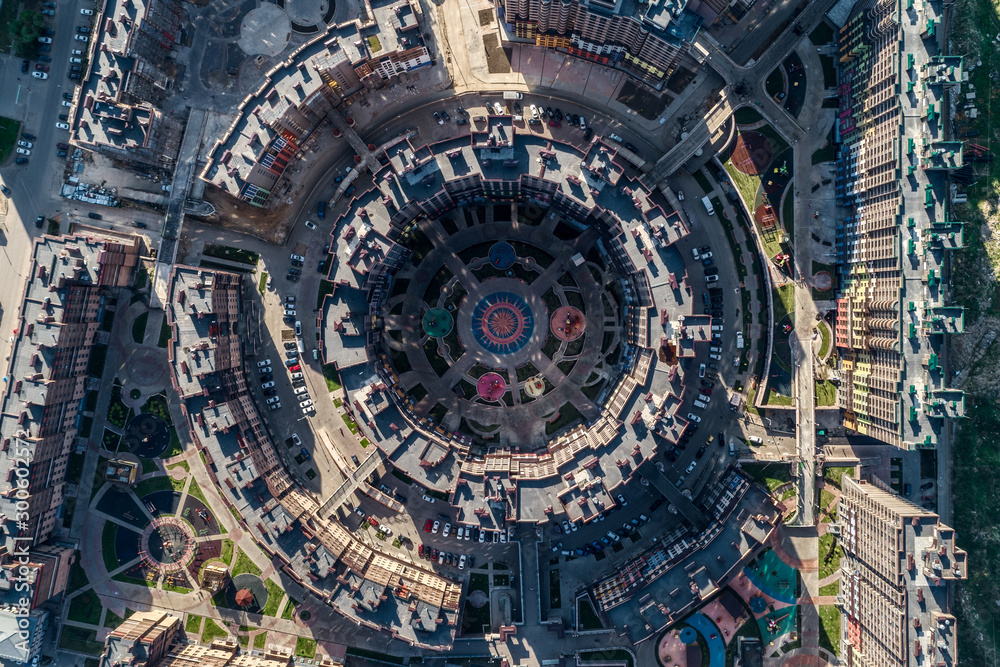 Big city, aerial view. Buildings are built in the form of closed rings.