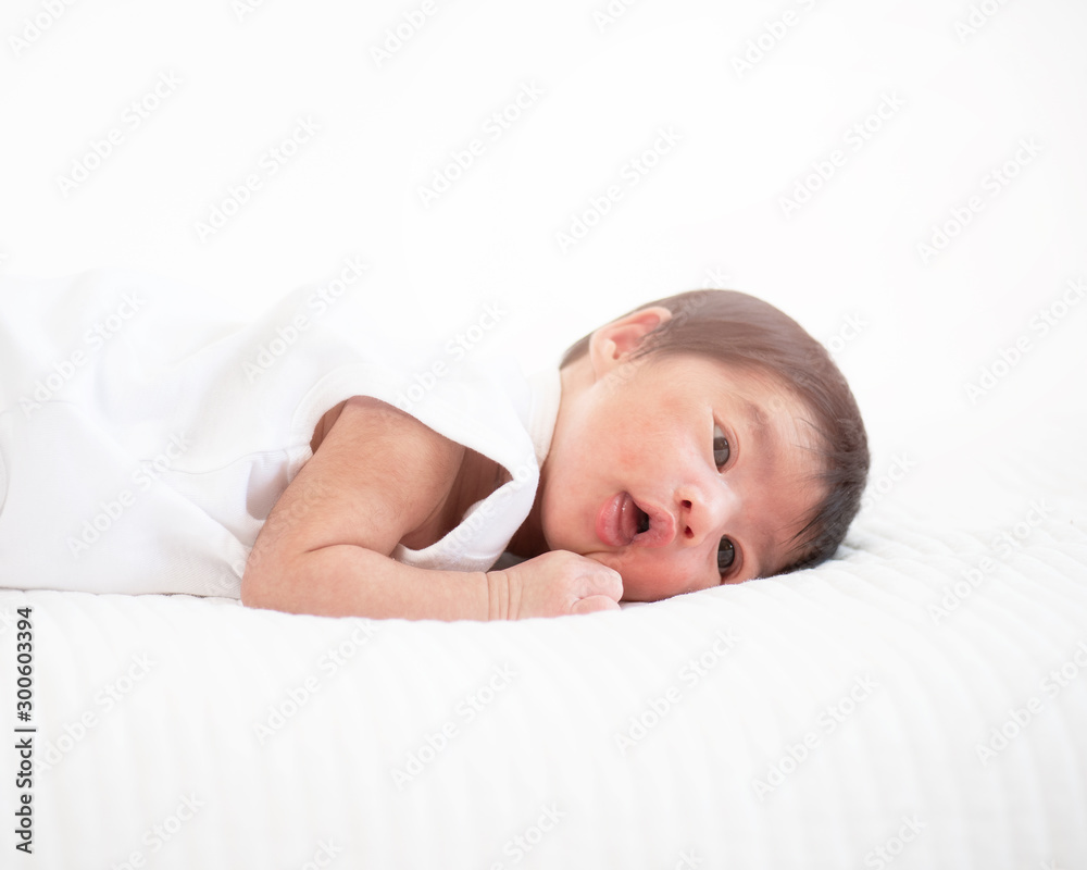 newborn baby sleep in bed on white background newborn baby sleep in bed on white background