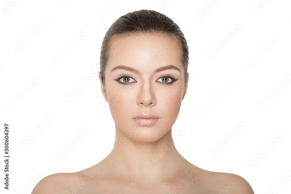 Beauty portrait of young woman brunette, looking at camera, skin care, make-up, dramatic eyes, isolated on white background. Caucasian model. Horizontal view. Beauty portrait of young woman brunette, looking at camera, skin care, make-up, dramatic eyes, isolated on white background. Caucasian model. Horizontal view.