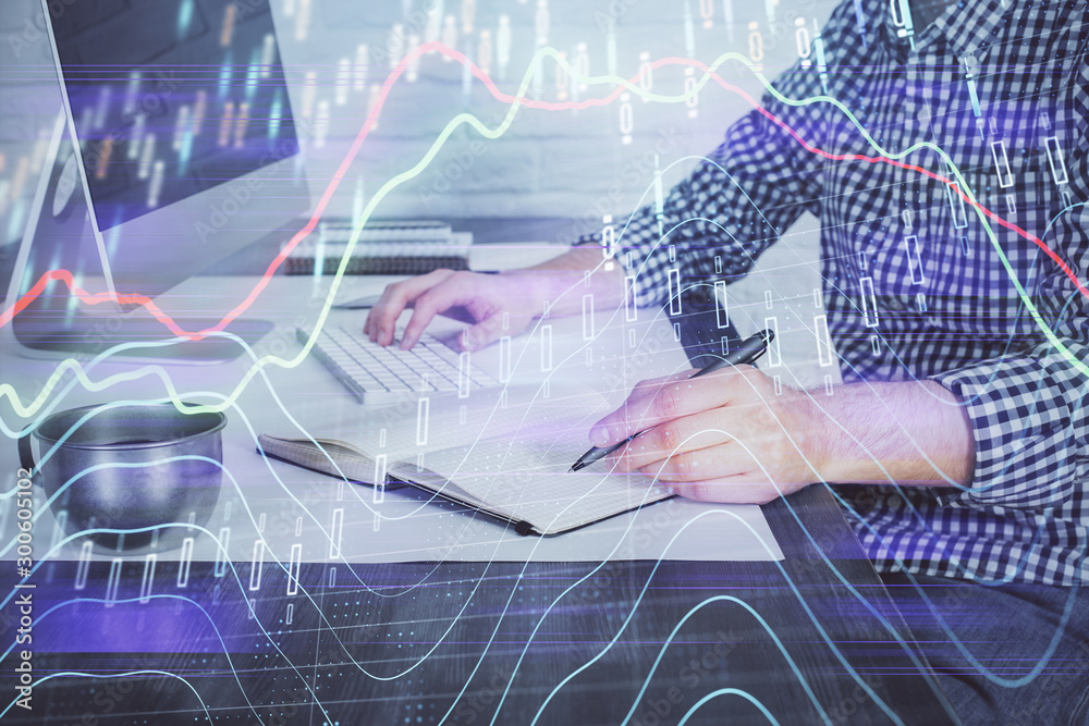 Naklejka premium Double exposure of stock market chart with man working on computer on background. Concept of financial analysis.