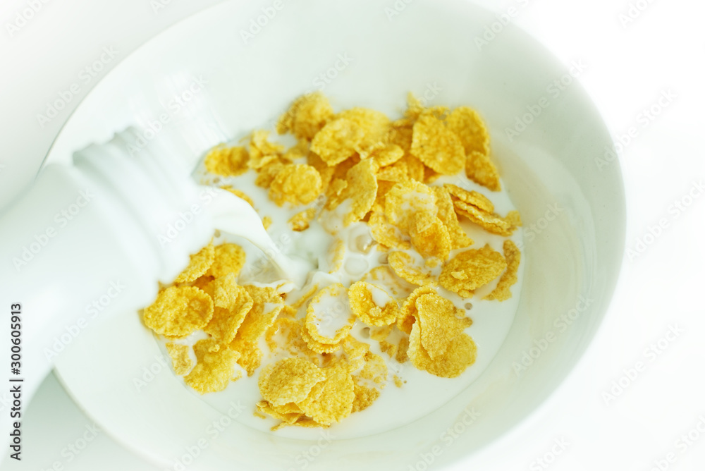 cereal with milk in a white plate for breakfast, space for text, isolate