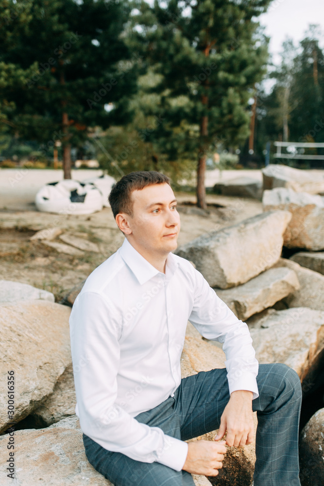 Obraz premium European wedding in the hotel. Gathering the groom in the interior Studio.