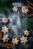 Christmas background with homemade cookies, cinnamon and spruce.