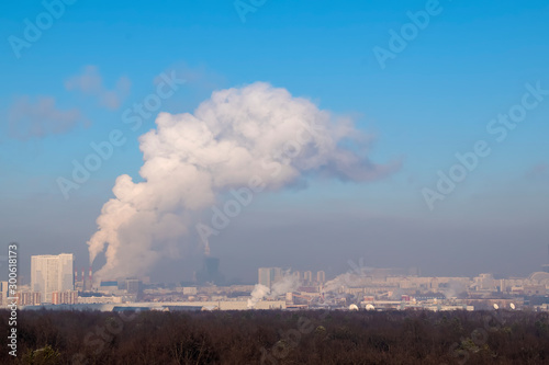 Panorama of the city, smog and smoke over the city in clear winter weather.