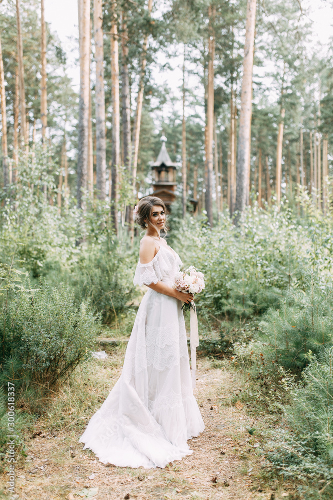 Elegant ceremony in European style. Beautiful bride in white flying dress in the forest. Elegant ceremony in European style. Beautiful bride in white flying dress in the forest.