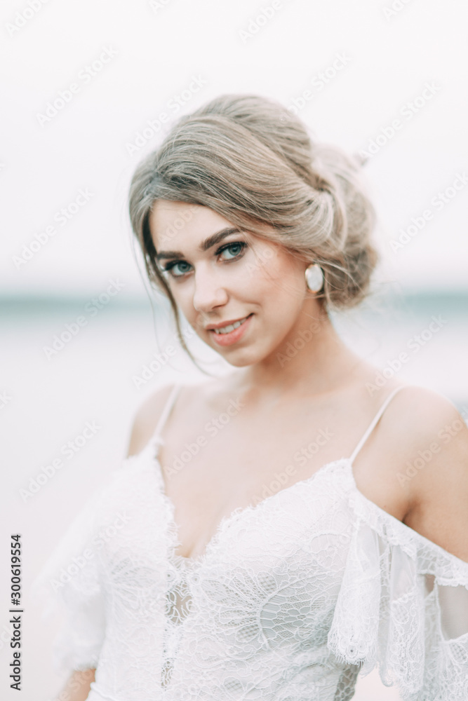 Wedding dress in European style. Happy bride at sunset on the lake. Wedding dress in European style. Happy bride at sunset on the lake.