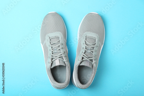 men's sneakers on a colored background top view. men's footwear. minimalism