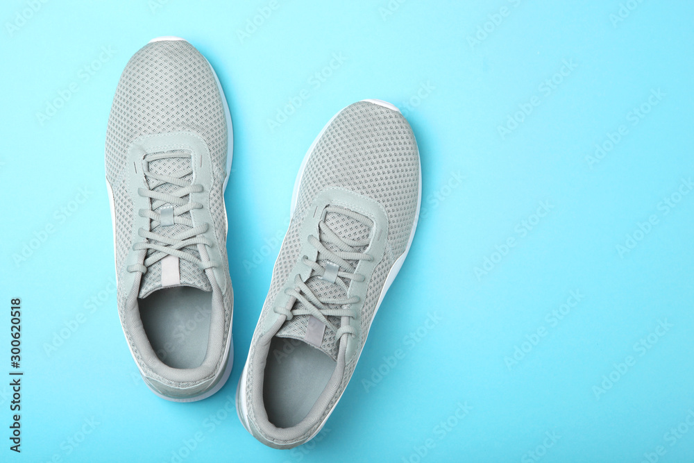 men's sneakers on a colored background top view. men's footwear. minimalism men's sneakers on a colored background top view. men's footwear. minimalism