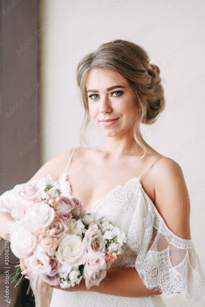 Fototapeta premium Stylish European style wedding in the hallway. Happy bride at the hotel.