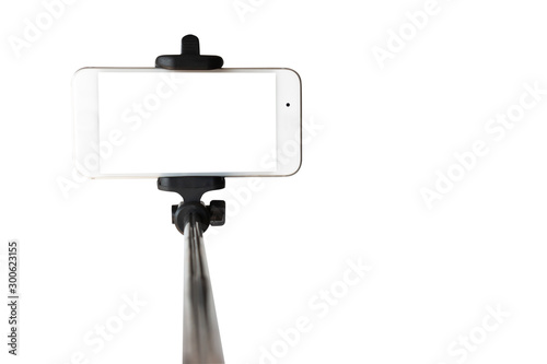 Monopod for selfie with smart phone. Selfie stick with smartphone isolated on white background. with clipping path