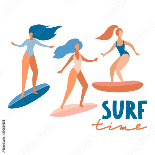 Surfer girls on boards catching waves in the sea