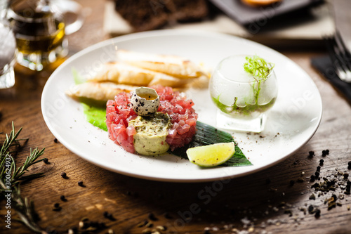 Tuna tartare served on a plate in restaurant