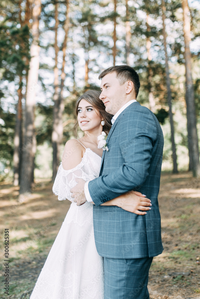 Stylish European wedding at sunset. Happy couple in the forest in nature. Stylish European wedding at sunset. Happy couple in the forest in nature.