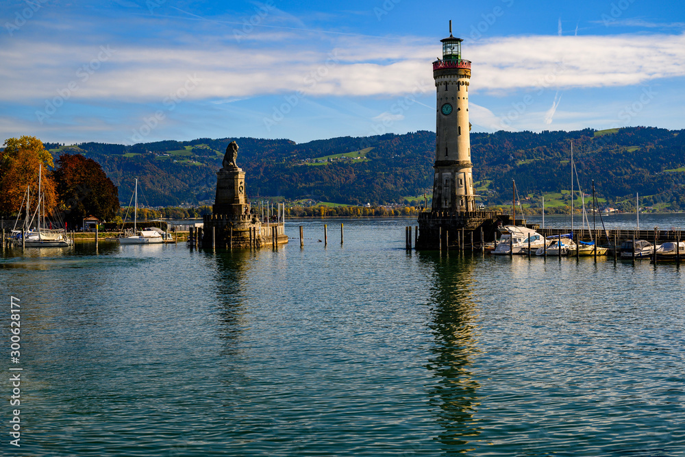 Entrance to Lindau harbor, statue and lighthouse.