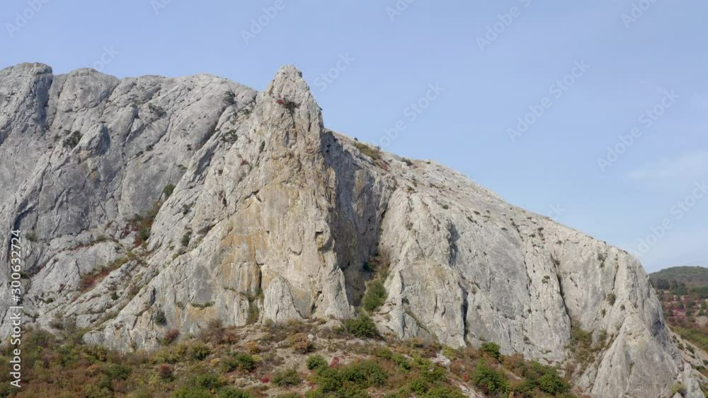 Landscape of mountain range on background blue sky. Aerial shot of rocky mountain peak. Landscape of mountain range on background blue sky. Aerial shot of rocky mountain peak.