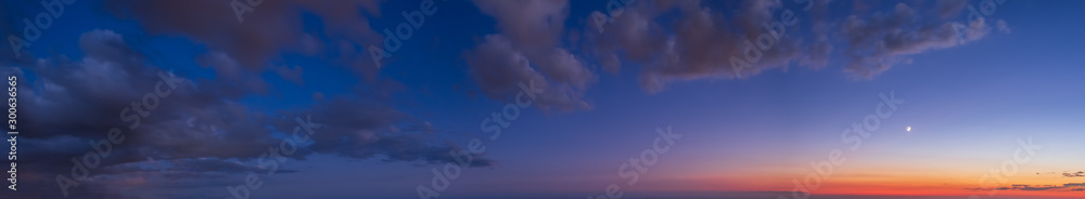 Night after sunset sky with clouds, stars and Moon (wide background panorama). - obrazy, fototapety, plakaty 