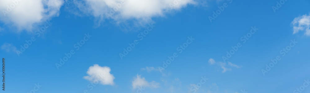 Blue sky with clouds and airplane track (wide background panorama). Blue sky with clouds and airplane track (wide background panorama).