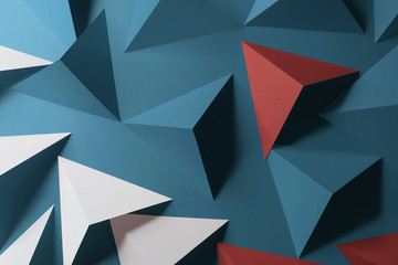 Composition with triangular shapes, red background