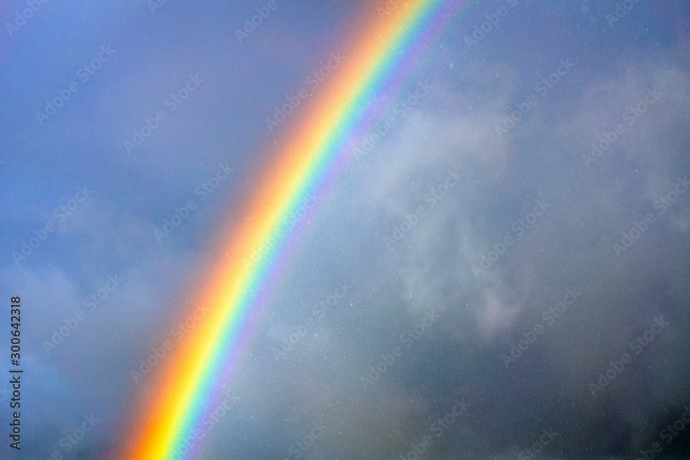 Rainbow in the rain. Nature, rainy, clouds, outdoors, weather, rainbows, color concept.