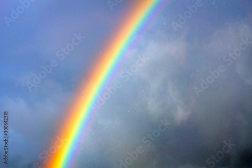 Rainbow in the rain. Nature, rainy, clouds, outdoors, weather, rainbows, color concept.