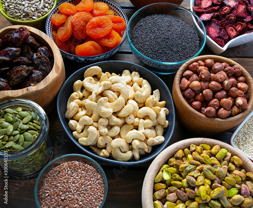 nuts  seeds and dried fruis on wooden surface