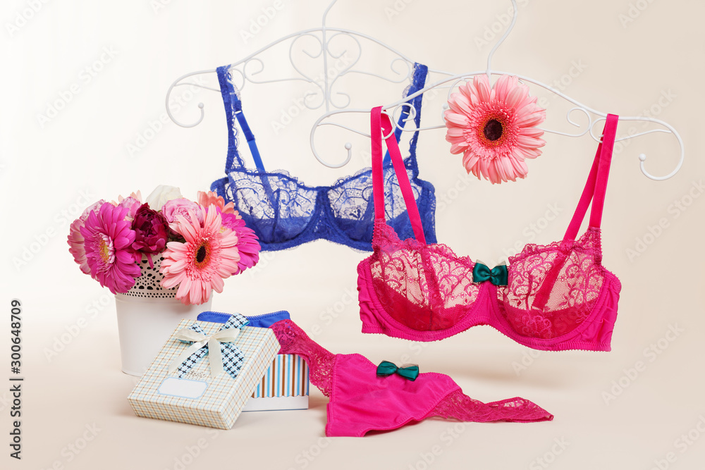 Two bra, panties and gerbera flowers - obrazy, fototapety, plakaty 