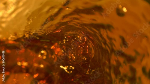 Tea Pouring with Swirl Whirlpool in the Glass on Phantom and Laowa photo
