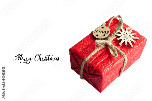 Christmas composition. Red Gifts box, wooden Christmas  decorations on white background. Christmas, winter, new year concept. Flat lay, top view, copy space