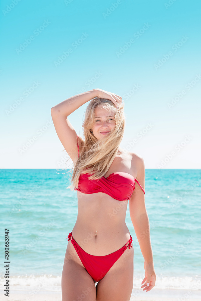 Portrait of blonde in swimsuit at the sea. Portrait of blonde in swimsuit at the sea.