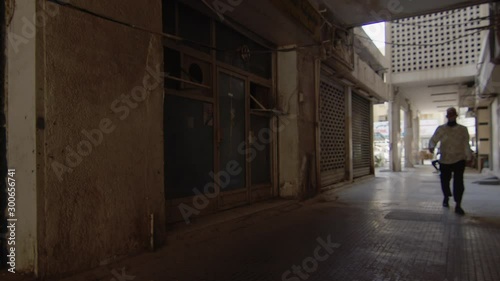 Man walking across old building in Dubai