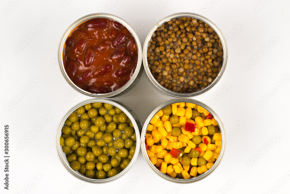 Canned food on white background. Green pea, beans, corn, lentils. Canned food on white background. Green pea, beans, corn, lentils.