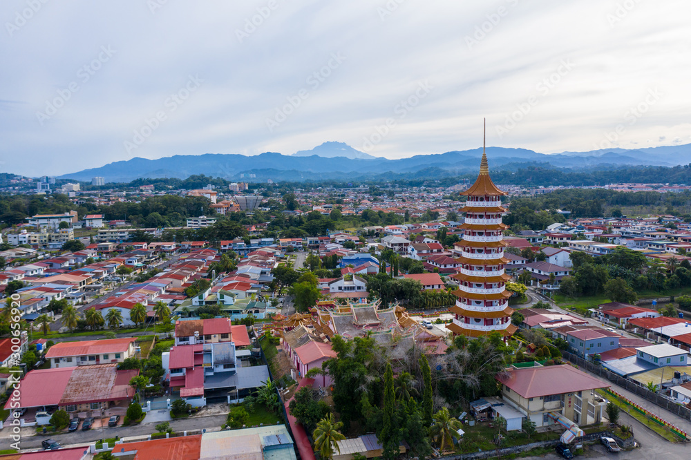 Aerial view of Chinese Temple Peak Nam Toong Pagoda during Sunny day located in the city of Kota Kinabalu, Sabah, Malaysia.