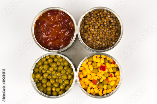 Canned food on white background. Green pea, beans, corn, lentils.