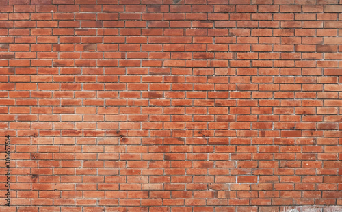 The background of the brick wall with dark orange is beautifully arranged. Ancient wall Grunge background The backdrop may be used in interior design.