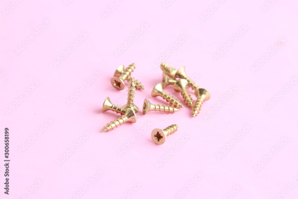 golden star screws, in colorful background golden star screws, in colorful background