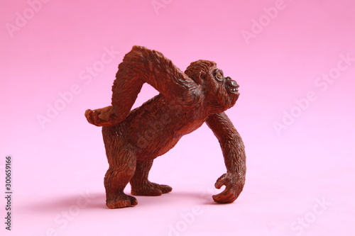 orangutan shaped plastic toy in color background