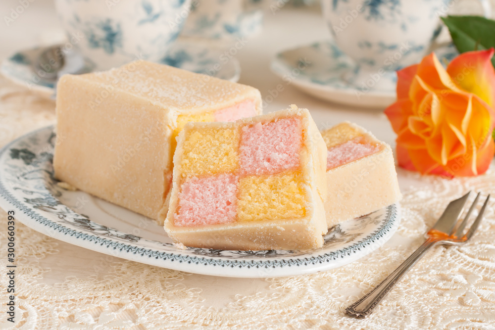 Battenberg cake or Battenberg square a sponge with pink a yellow checks covered in marzipan Battenberg cake or Battenberg square a sponge with pink a yellow checks covered in marzipan