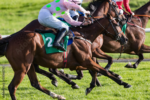 Fotografia, Obraz Horse racing action, Close up on galloping race horses and jockeys competing at