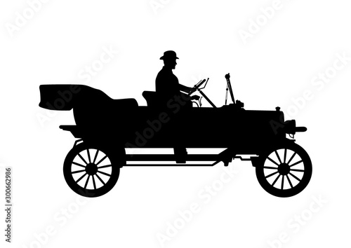 Old car silhouette. Vintage touring car with driver in bowler hat. Side view. Flat vector.