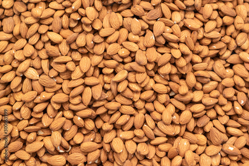 Dried almonds background, organic foods in market.