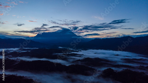 Fototapeta Naklejka Na Ścianę i Meble -  Rural landscape with dramatic sea of cloud during sunrise with Mount Kinabalu at Saba, Borneo