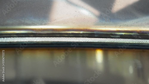 Static shot of a welding seam at a stainless steel pressure tank, vessel.