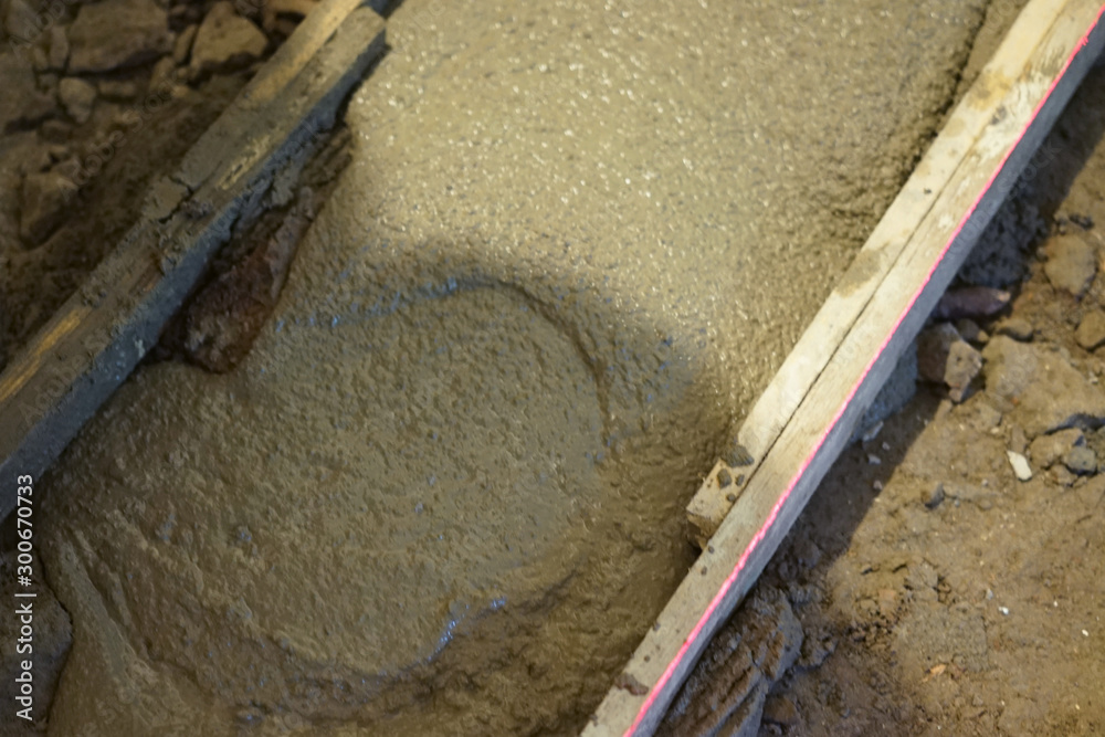 Close-up view of making fresh concrete floor. Close-up view of making fresh concrete floor.